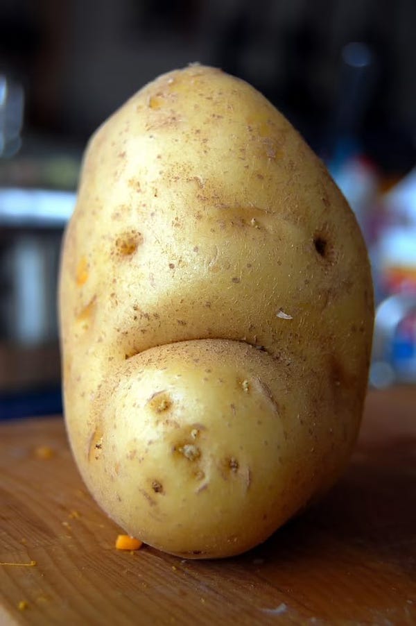 A potato with a sad face on it