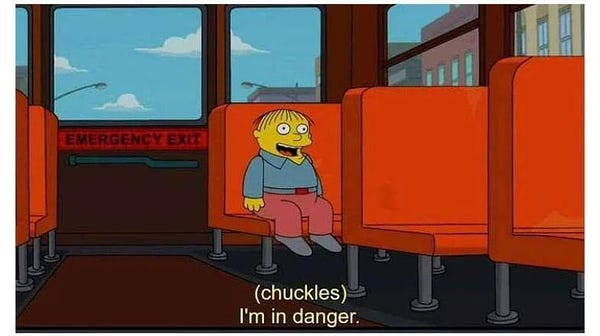 A Simpsons meme of Ralph sitting on the bus. The caption reads, “(chuckles) I’m in danger.” Ralph is all of us.