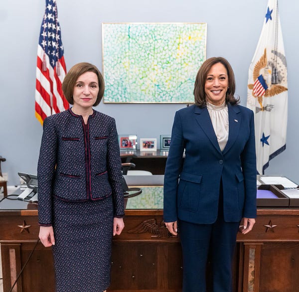 President Sandu of Moldova and Vice President Harris stand for a photo in her West Wing office.