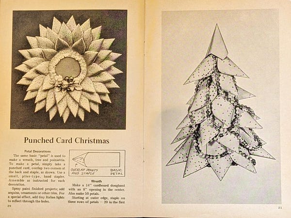 A wreath and Christmas tree made from punch cards.