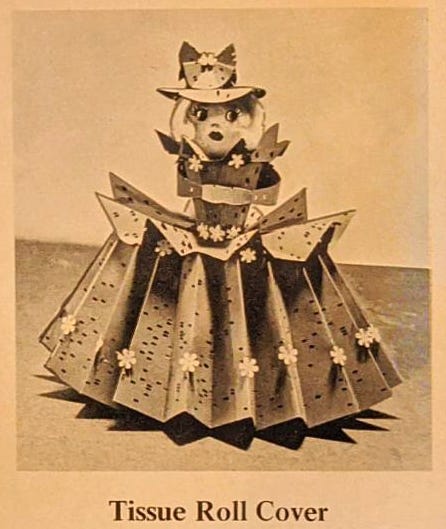 A tissue roll cover, a doll with a skirt made from punch cards.