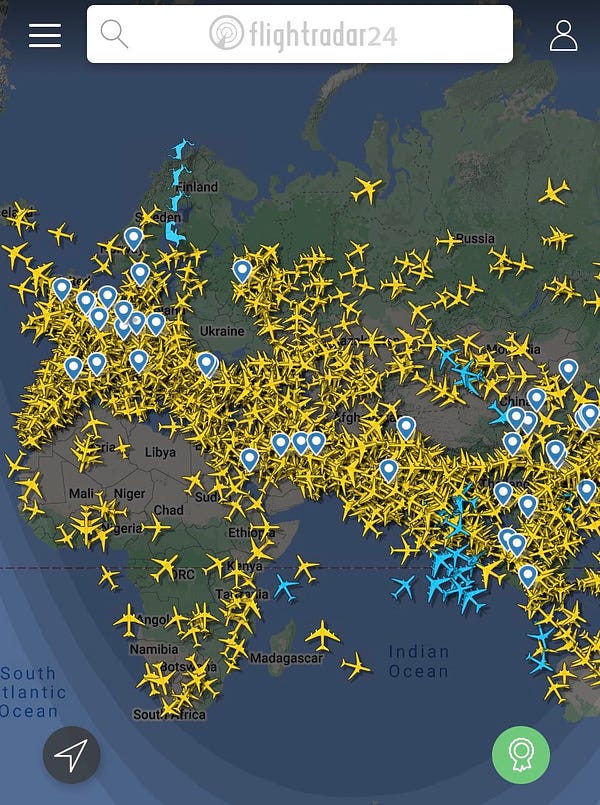 FlightRadar2: map of Europe, Africa and part of Russia/China. Yellow planes are covering all of Europe, scattered across Africa, and covering the Middle East, India, & parts of China. Handful of blue planes (satellite based tracking) above the Indian Ocean. Sparse air traffic above western/northern Russia.