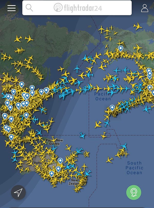 East Russia/China, Australia, New Zealand and the Pacific Ocean & Pacific US seaboard. Yellow planes are covering east Asia, covering New Zealand, and mostly covering Australia. Huge lines of planes are flying across the pacific & to and from Hawaii, Alaska, & the western US seaboard.