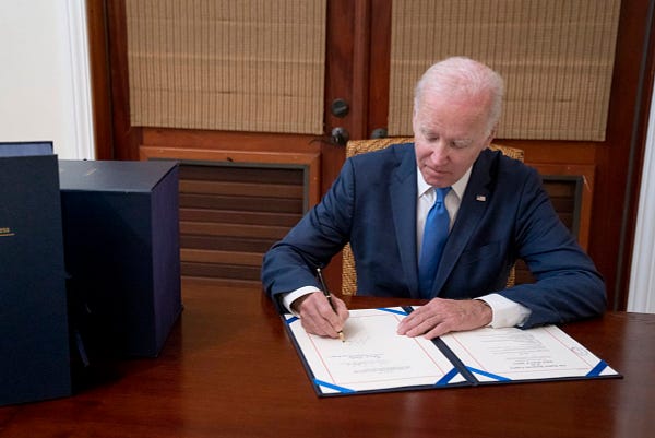 President Biden signs the bipartisan omnibus bill into law. 
