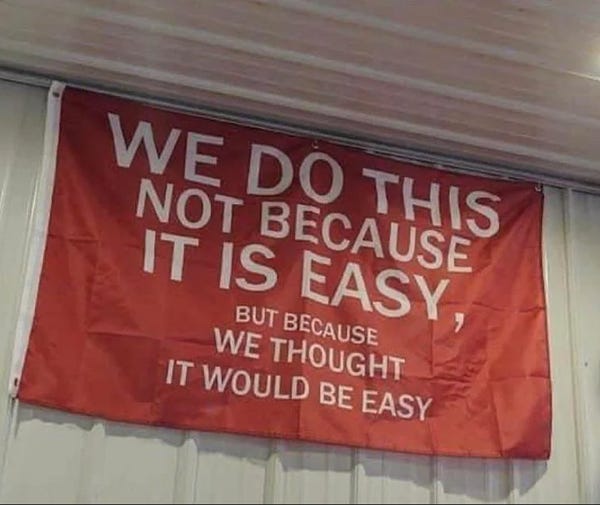 Flag that says "we do this not because it is easy, but because we thought it would be easy"