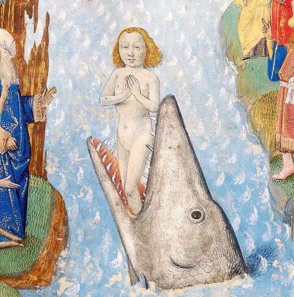 A medieval drawing of a young naked man standing and praying inside the mouth of a giant fish