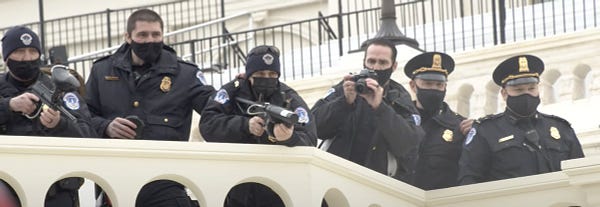 6 Capitol Police Officers aiming to fire upon January 6 Peaceful Protesters at the Capitol in Washington DC. The Officer in the center has been identified as the shooter of Joshua Matthew Black, who survived the attack by the officer.
