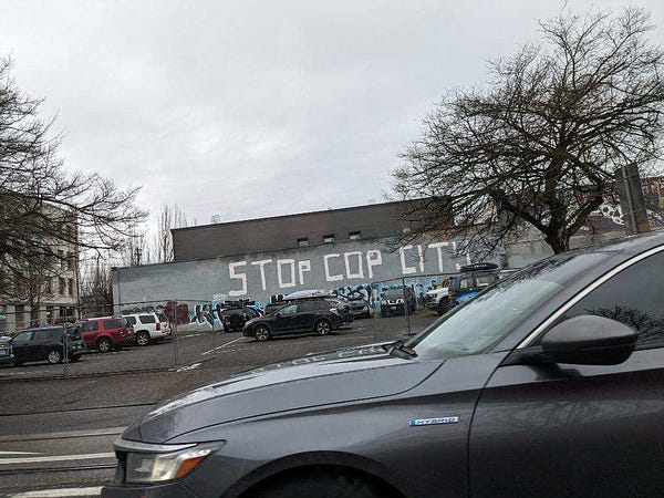 Artwork on wall that said stop cop city