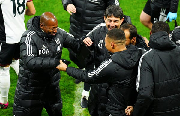 Luis Boa Morte and Carlos Vinicius celebrate the win at full-time.