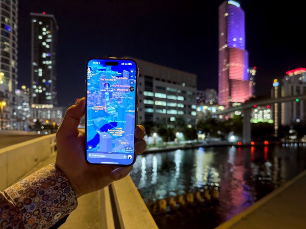 Joz’s iPhone shows the Miami Tower as a 3D landmark on Apple Maps, with the Miami skyline in the background.