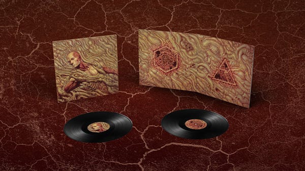 The Scorn vinyl with black discs and artwork depicting a flow of intestinal matter and iconography from the game