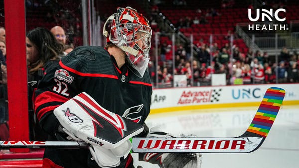 Photo of Antti Raanta taking the ice during warmies with his stick taped with Pride Tape