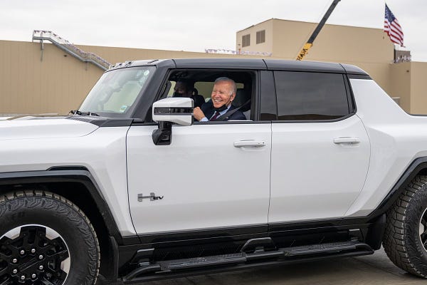 President Biden test drives an electric vehicle.