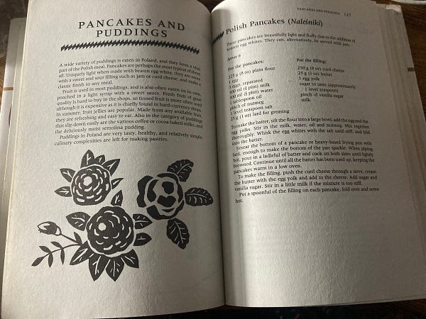 Open pages on the chapter Pancakes & Puddings - black & white thick lined illustration of flowers & a recipe for Polish pancakes