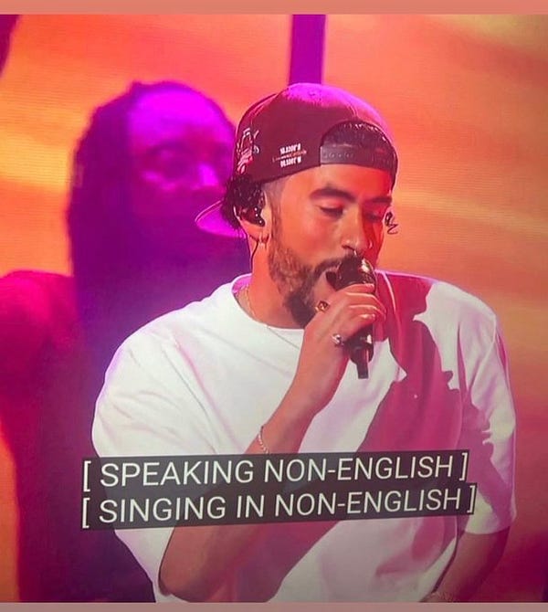 Broadcast of Bad Bunny’s 2023 Grammy Awards performance with closed captions that read, “[SPEAKING NON-ENGLISH] [SINGING IN NON-ENGLISH]”