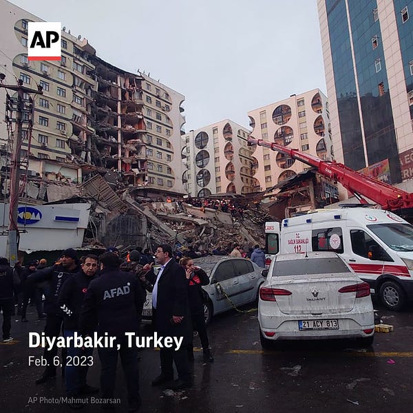 Rescue workers and medical teams try to reach trapped residents in a collapsed building following and earthquake in Diyarbakir, Turkey.