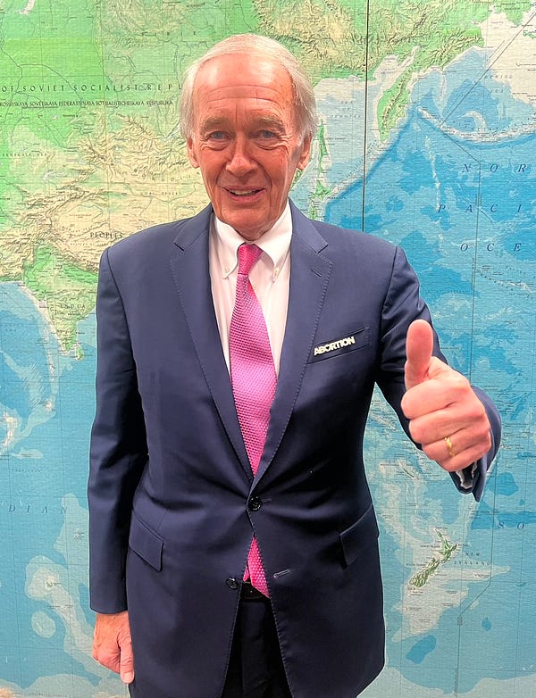 Ed Markey gives a thumbs up while wearing his abortion pin before tonight’s State of the Union address