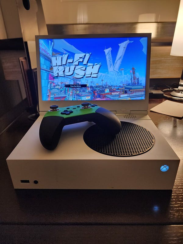 Xbox Series S with xscreen attached with hi fi rush on the screen. 