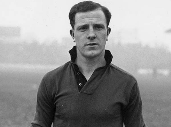 a young stan cullis with collar upturned and clean cut side parting.