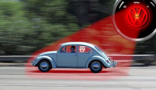 A blue vintage VW beetle speeds down a highway; a crying baby is pressed against the back driver's-side window. In the sky overhead is the red glaring eye of HAL 9000 from 2001: A Space Odyssey, emblazoned with the VW logo. The eye is projecting a beam of red light that has enveloped the car.

Image:
Cryteria (modified)
https://commons.wikimedia.org/wiki/File:HAL9000.svg

CC BY 3.0
https://creativecommons.org/licenses/by/3.0/deed.en

--

Upsilon Andromedae (modified)
https://www.flickr.com/photos/upsand/212946929/

CC BY 2.0
https://creativecommons.org/licenses/by/2.0/