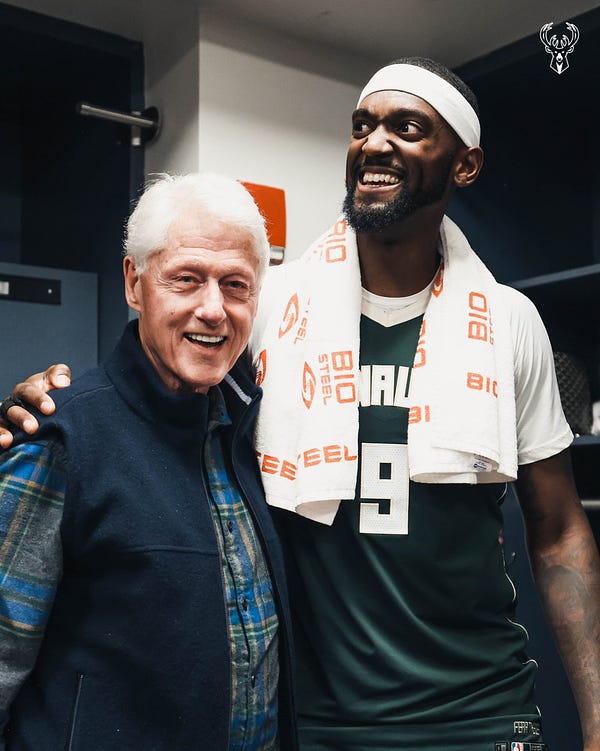 Bobby hugging Bill Clinton in the locker room postgame. 