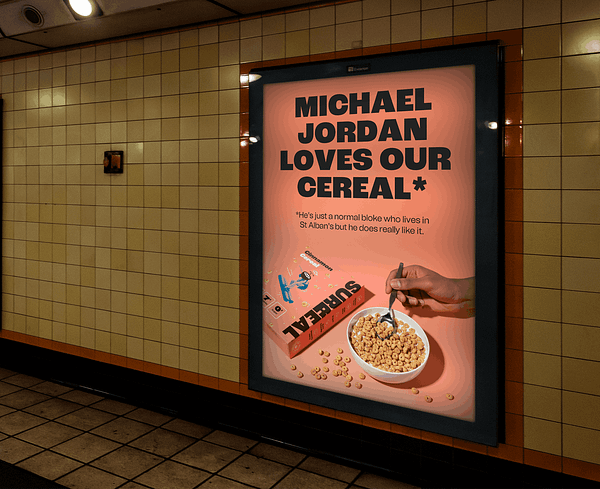 This billboard says "Michael Jordan loves our cereal". Then in small letters it says "He's just a normal bloke who lives in St Albans but he does really like it"