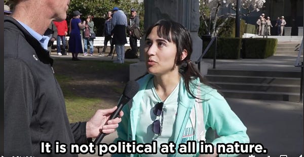 Still from a Heritage Foundation video of Jay Richards attending the Sacramento Detrans Awareness Day rally. Richards is interviewing Chloe Cole Brockman. Caption for the video reads It is not political at all in nature.