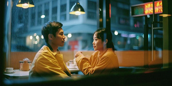 photography shot trough an outdoor window of a coffee shop with neon sign lighting, window glares and reflections, depth of field, a romantic young asisan couple sitting at a table, portrait, kodak portra 800, 105 mm f1. 8 --ar 2:1 --v 5