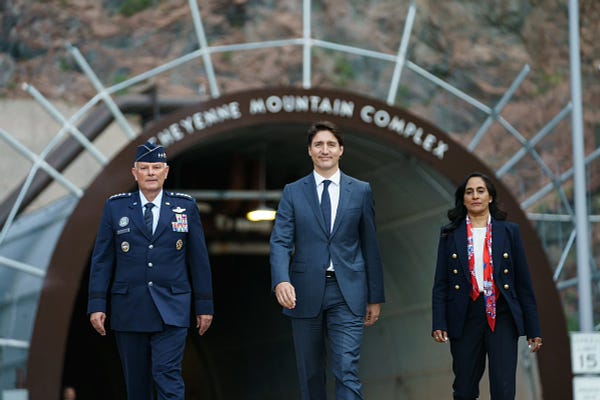 Prime Minister Trudeau, Minister Anand, and General Glen D. VanHerck at the Cheyenne Mountain Complex.