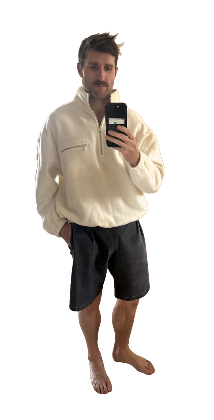 Brian in the white Rier half zip, cut out on forest green