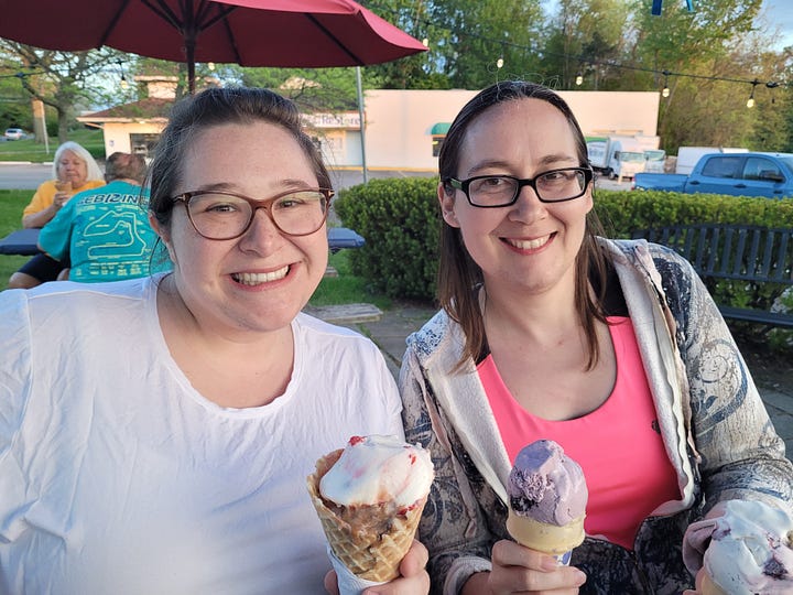 Four photos: One is Jade posing with two friends at a summer lawn concert. One is Lyndsey posing with a friend at an ice cream stand. One is of Jade and Lyndsey in a pool with two friends. The last is of Jade and their mom holding cans that say "regular beer" on them.