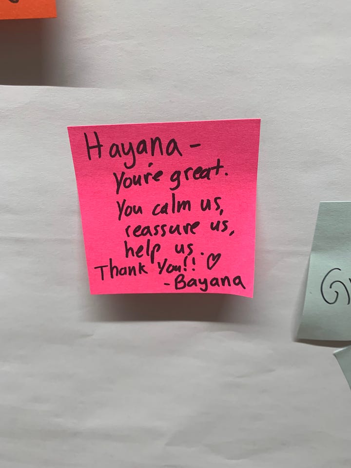 A series of 4 colorful post-it notes from students left in 2019