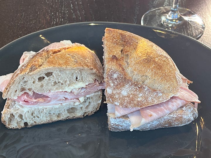 Photos of wine and a ham sandwich.