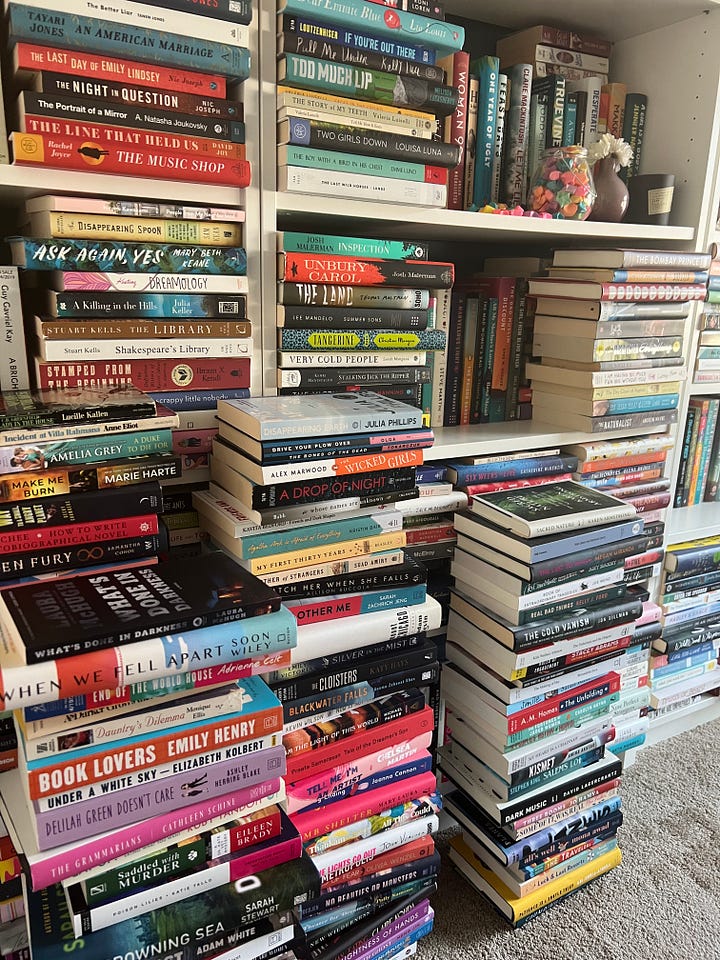 Two photos of gigantic book stacks, overflowing from the shelves and onto the floors. 