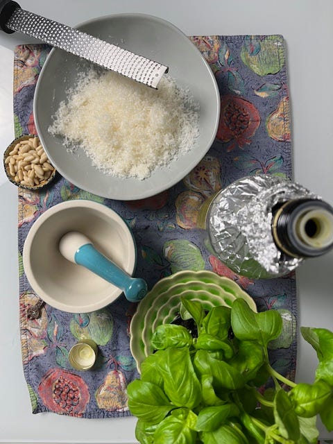 Pesto Genovese pine nuts italian cheese basil smashed together with a mortar pestle