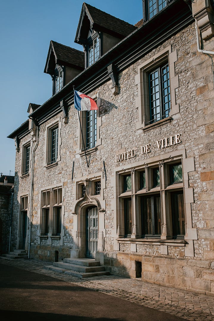 A French flag waves on the exterior of the town hall in Moret-sur-Loing France