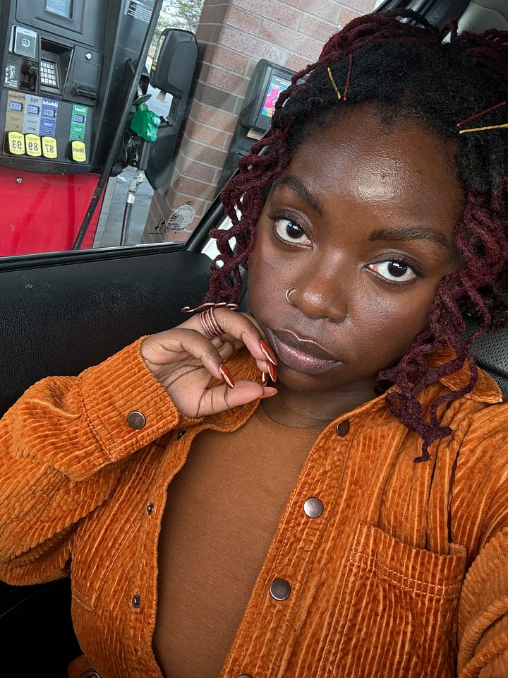 a black femme inrust/burnt orange sits in a car at the gas station. in the first image she pouts. in the second her eyes roll in agony.