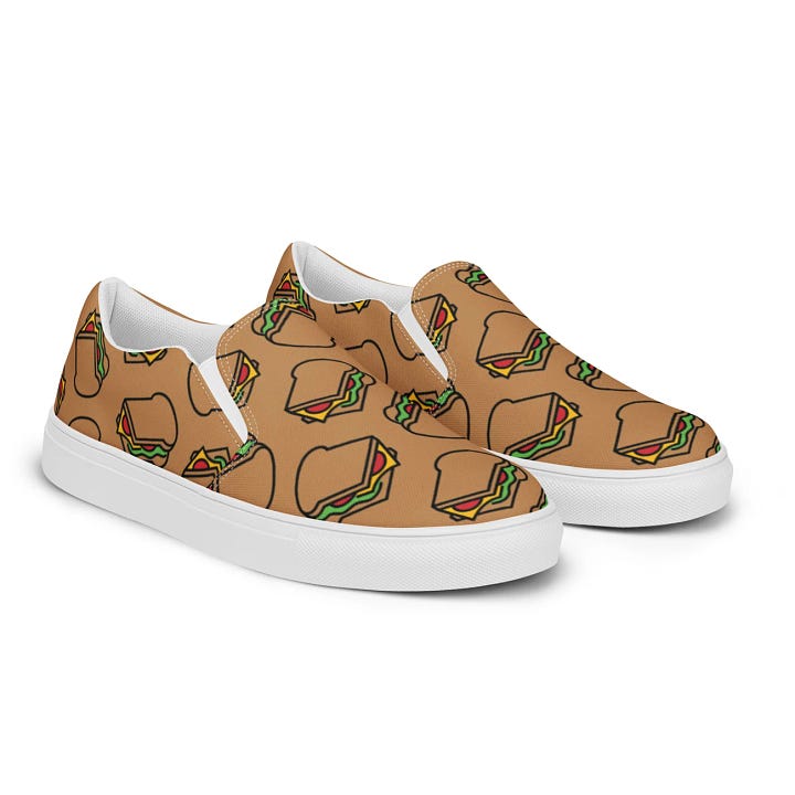 short sleeved t-shirts with various Sandwiches of History illustrations on them and one pair of Vans-style slip on shoes with an all over sandwich pattern.