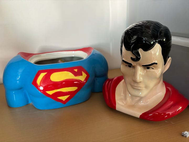 A ceramic candy-jar bust of Superman, filled with Jolly Rancher candies.