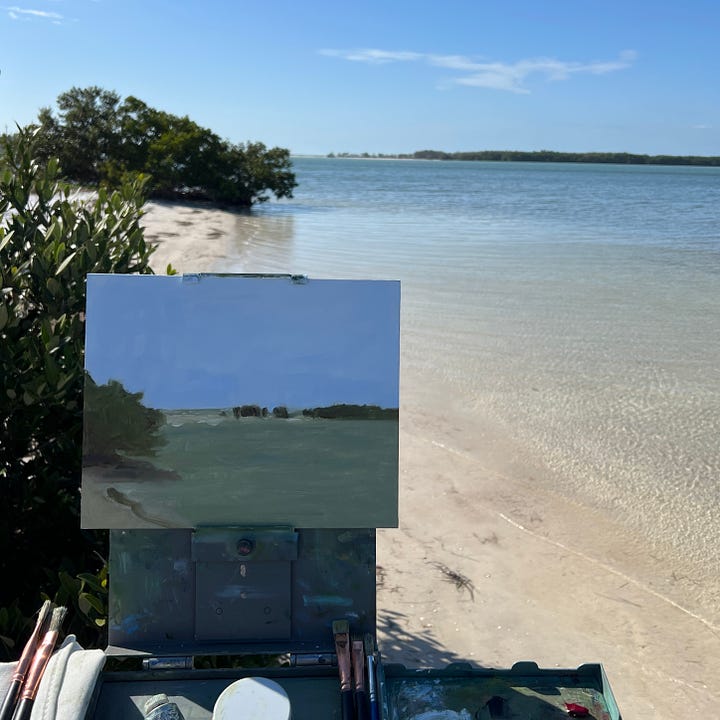 Two images showing a man standing in front of an outdoor painting easel, and then the finished painting on the easel and in hand.