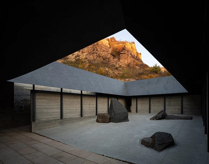 Images of a Chinese Buddhist temple built next to the Great Wall of China by Atelier Deshaus