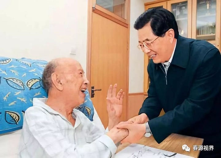 Qian Xuesen with four generations of leaders of the People's Republic of China, in chronological order: Mao Zedong, Deng Xiaoping, Jiang Zemin, and Hu Jintao.