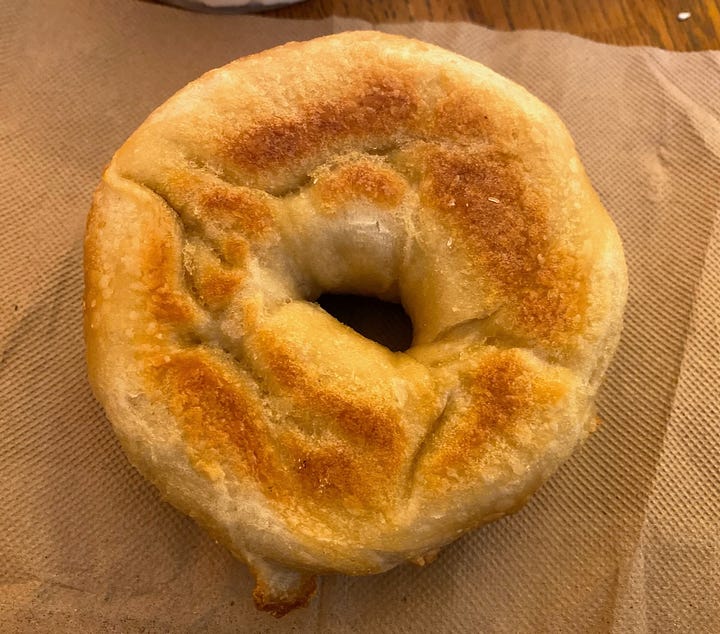 The side and bottom of the plain bagel.