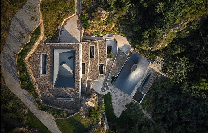 Images of a Chinese Buddhist temple built next to the Great Wall of China by Atelier Deshaus