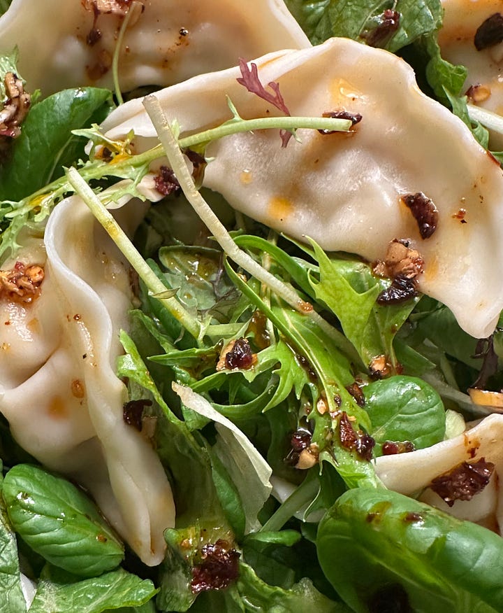 Assembling a dumpling salad