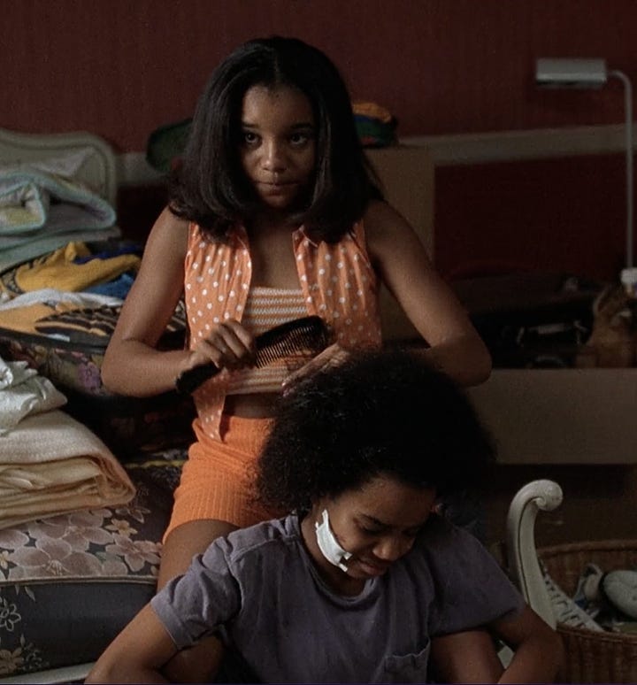 Black women hair braiding scenes from movies. 