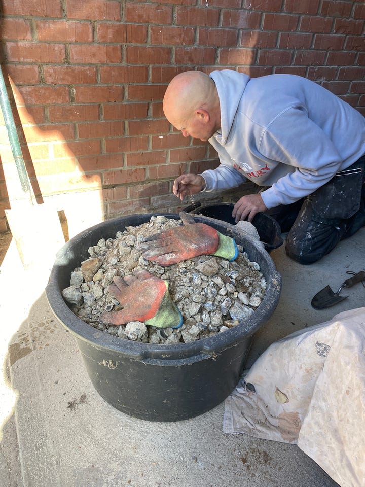 starting to gig out the footings and a bucket full of rubble