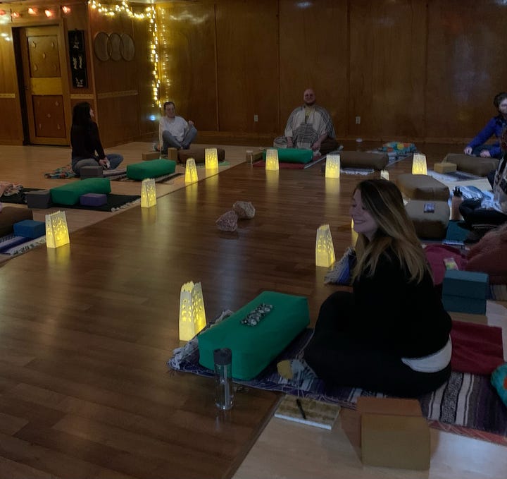 MFA students preparing to do some personal essay writing and candlelit meditation at The Healing Moon