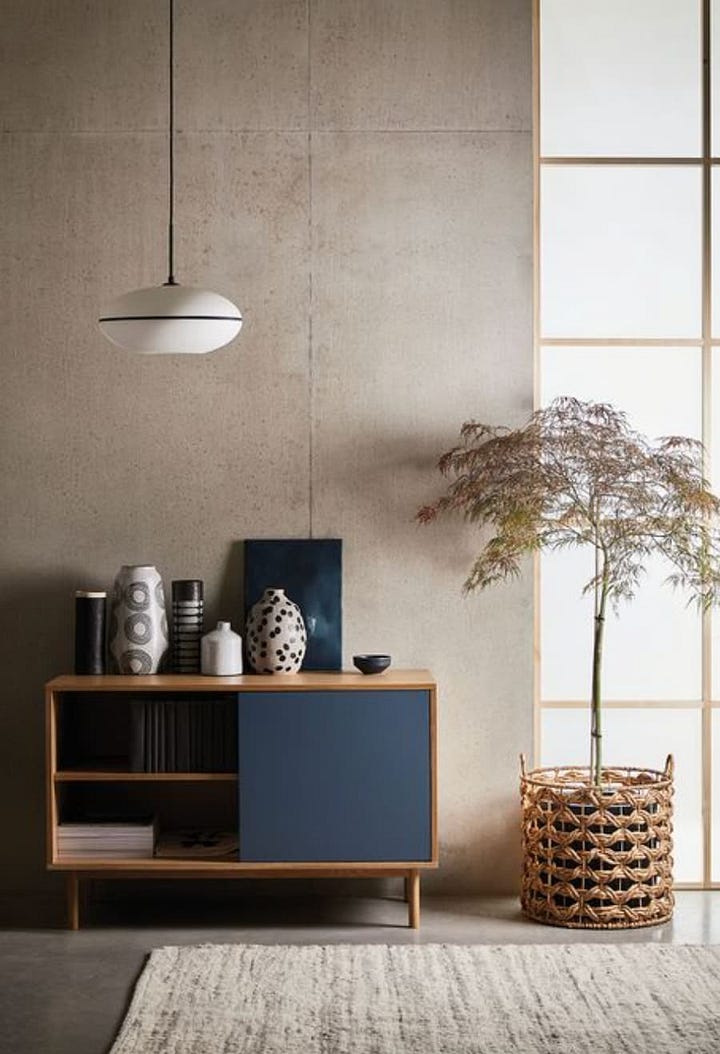 Image 1: blue office combined with natural wood Image 2: neutral room with blue accented furniture