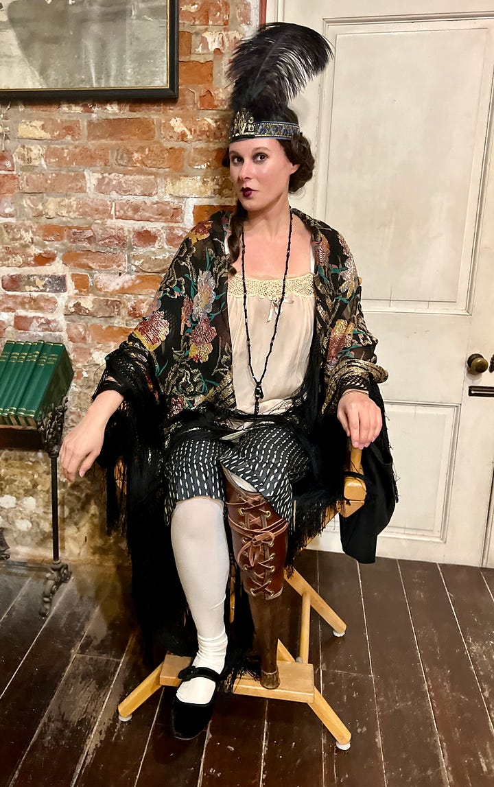 Actor Rachel Handler, brunette woman who looks about 30, appears as the character Doris in AMC's vampire series. Like Handler, Doris is an amputee. She's dressed in early 1900s garb, with per the character, brothel-style petticoats. As Doris, Handler's normal prosthetic leg is switched with a peg leg amputees at the time would have to utilize.